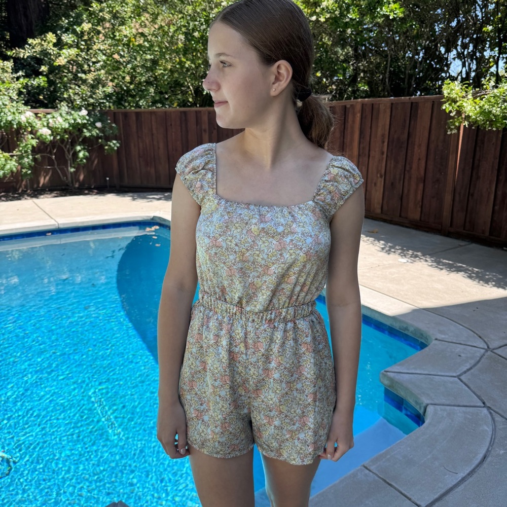 altard state floral ruffle romper in soft pastel tones